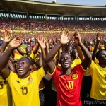 우간다의 스포츠 문화 - **Vibrant Ugandan Football Celebration:** A dynamic wide-angle shot capturing the essence of Ugandan...
